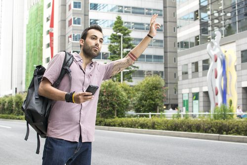 Man Orders Uber Car with Cell Phone