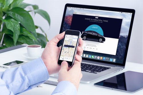 Order Uber Car from Cell Phone, Shows Computer
