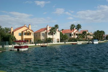 Desert Shores Homes are showing on the water with boats coming off the private docks