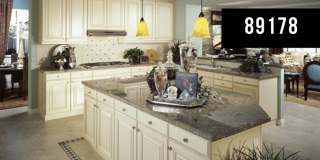 Contemporary Kitchen with yellow lighting, grey top on island, reads 89178