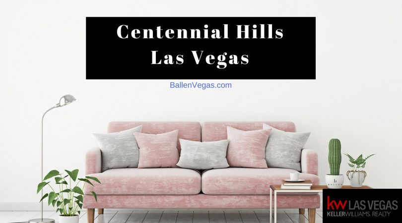 Pink Couch with Grey Pillows and lamps and plants are in a living room. Sign reads Centennial Hills Las Vegas