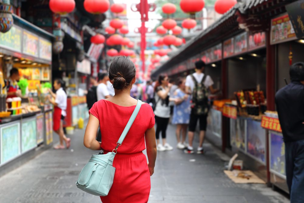 Woman in Red Dress walks down the street in Chinatown Las Vegas