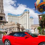 fancy red car driving in Las Vegas