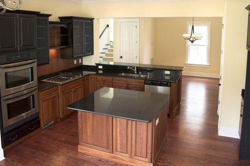 dark kitchen, hardwood floors, island 