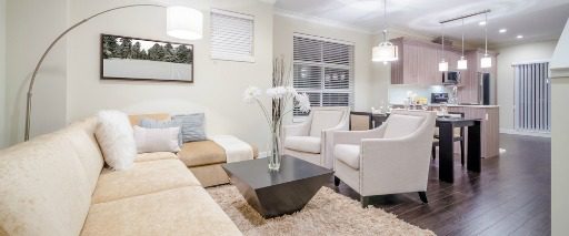 open floor plan of condo with white furnishings