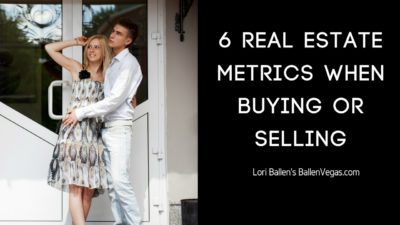Young couple is standing in front of real estate and the sign next to them reads 6 real estate market metrics when buying or selling